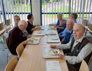 Myk, vanhusten kouluvierailu, vaakauva